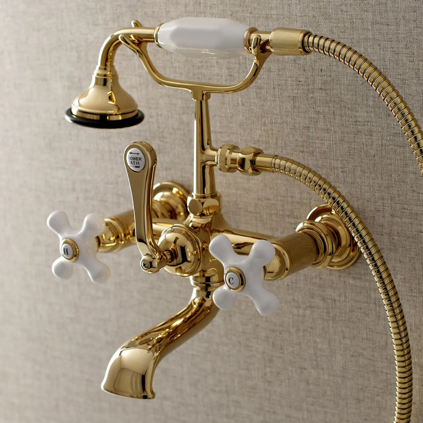 Kingston Brass Aqua Vintage 7-Inch Wall Mount Tub Faucet with Hand Shower