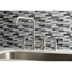 Kingston Brass Concord Two-Handle Deck Mount Bridge Kitchen Faucet with Brass Side Sprayer