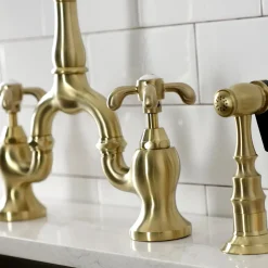 Kingston Brass Heirloom French Country Two-Handle 3-Hole Deck Mount Bridge Kitchen Faucet with Brass Sprayer