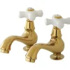 Kingston Brass Heritage Basin Tap Faucet with Porcelain Cross Handle