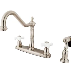 Kingston Brass Heritage 8" Center Kitchen Faucet with Brass Sprayer and Porcelain Cross Handle