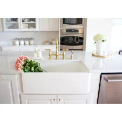 Kingston Brass Heritage 8-Inch Bridge Kitchen Faucet with Brass Sprayer