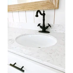 Kingston Brass Heritage 4-Inch Centerset Bathroom Faucet with Pop-Up Drain