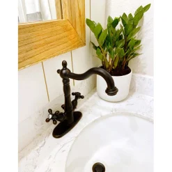 Kingston Brass Heritage 4-Inch Centerset Bathroom Faucet with Pop-Up Drain