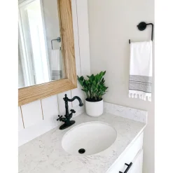 Kingston Brass Heritage 4-Inch Centerset Bathroom Faucet with Pop-Up Drain