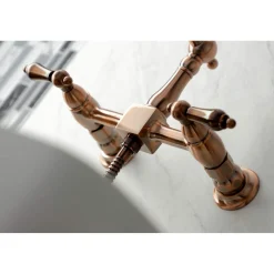 Kingston Brass KS124ALBSAC Heritage Two-Handle Wall Mount Bridge Kitchen Faucet with Brass Sprayer, Antique Copper