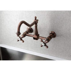 Kingston Brass KS124AXAC Heritage Two-Handle Wall Mount Bridge Kitchen Faucet, Antique Copper