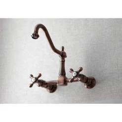 Kingston Brass KS124AXAC Heritage Two-Handle Wall Mount Bridge Kitchen Faucet, Antique Copper
