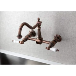 Kingston Brass KS124PLAC Heritage Two-Handle Wall Mount Bridge Kitchen Faucet, Antique Copper