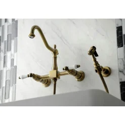 Kingston Brass KS124XPLBS-P Heritage Two-Handle Wall Mount Bridge Kitchen Faucet with Brass Sprayer