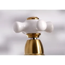 Kingston Brass Restoration Deck Mount 8" Bridge Kitchen Faucet with Sprayer