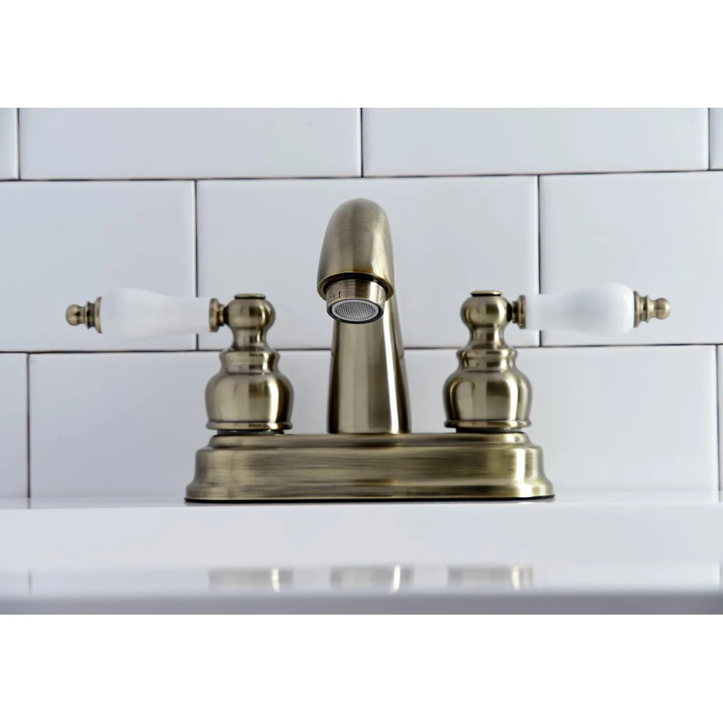 Kingston Brass Restoration Deck Mount 4-Inch Centerset Bathroom Faucet