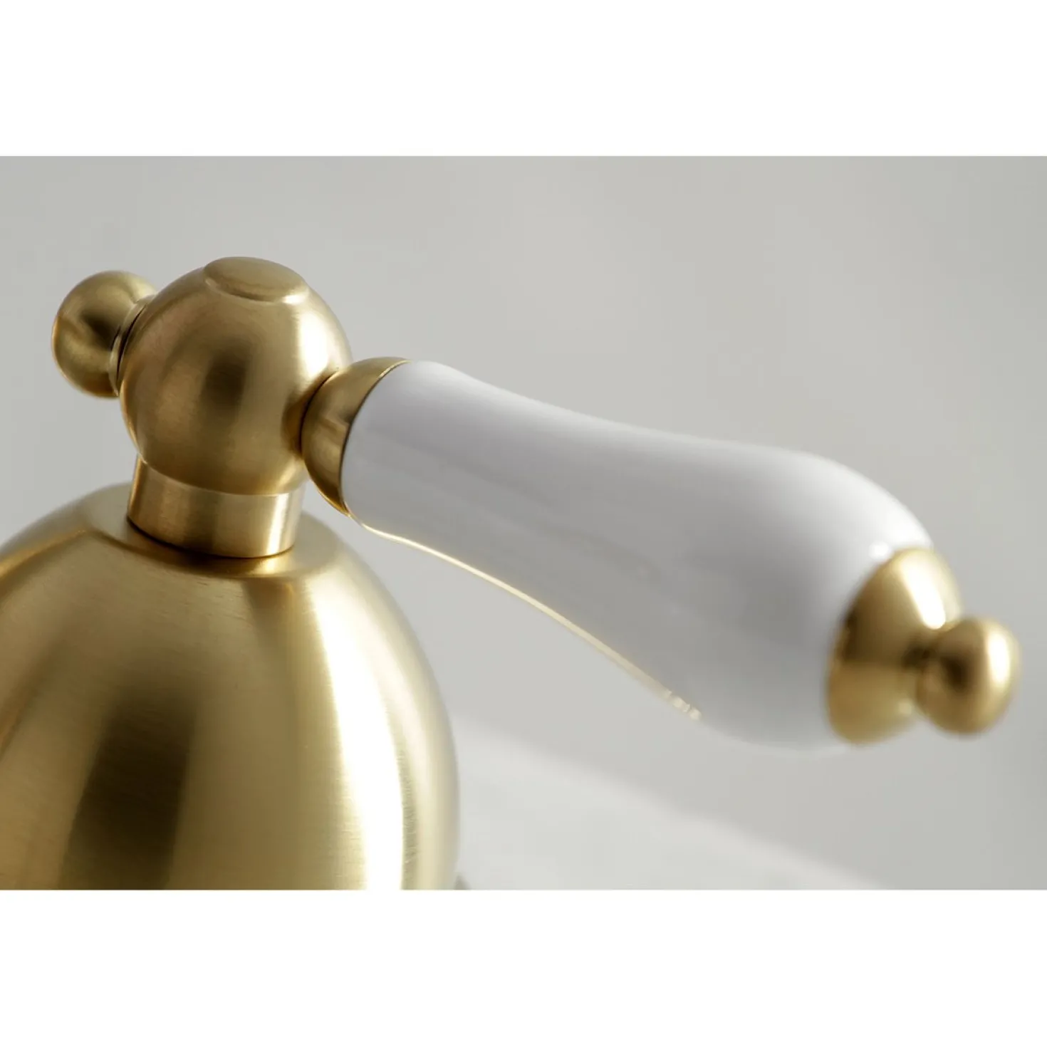 Kingston Brass Restoration Deck Mount 8-Inch Widespread Bathroom Faucet