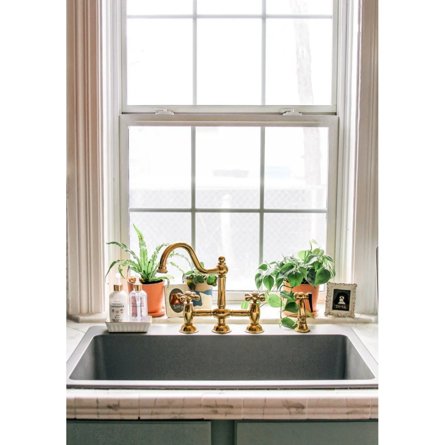 Kingston Brass Restoration Kitchen Bridge Faucet with Brass Sprayer