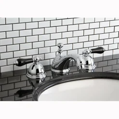 Kingston Brass Restoration Onyx Widespread Lavatory Faucet with Black Porcelain Lever Handle