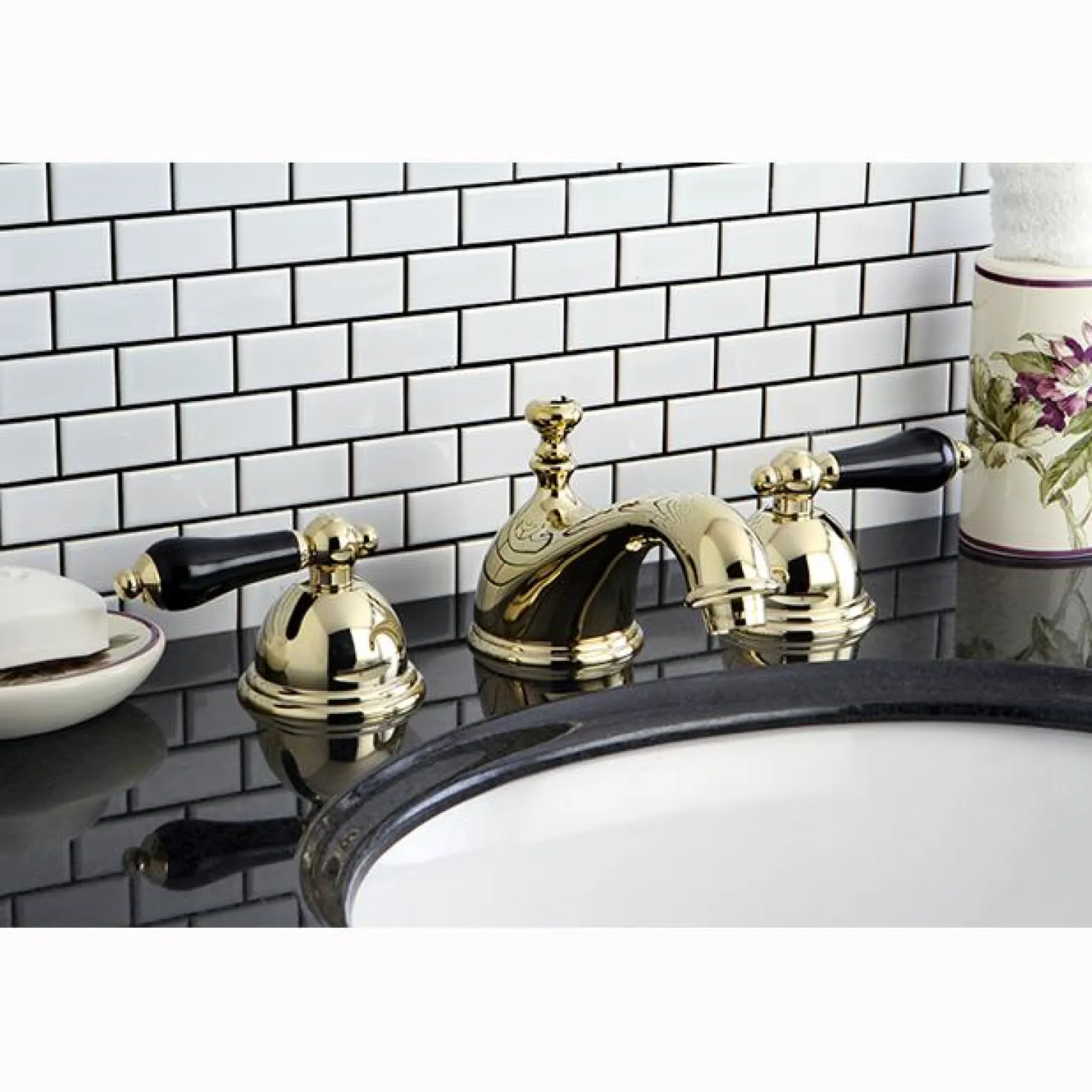 Kingston Brass Restoration Onyx Widespread Lavatory Faucet with Black Porcelain Lever Handle