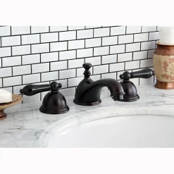Kingston Brass Restoration Onyx Widespread Lavatory Faucet with Black Porcelain Lever Handle