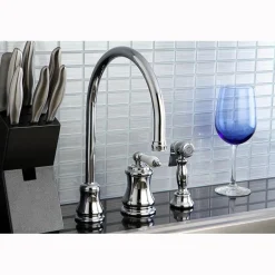 Kingston Brass Single Handle Widespread Kitchen Faucet with Brass Sprayer and Porcelain Lever Handle