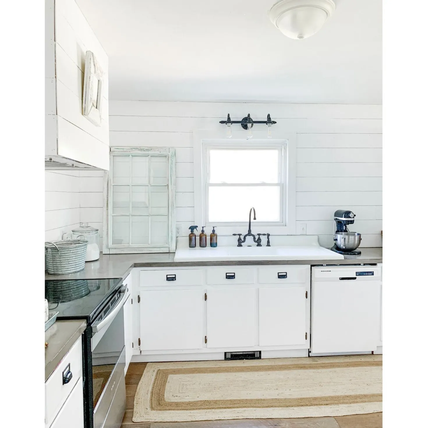 Kingston Brass Tudor Bridge Deck Mount Kitchen Faucet with Brass Sprayer