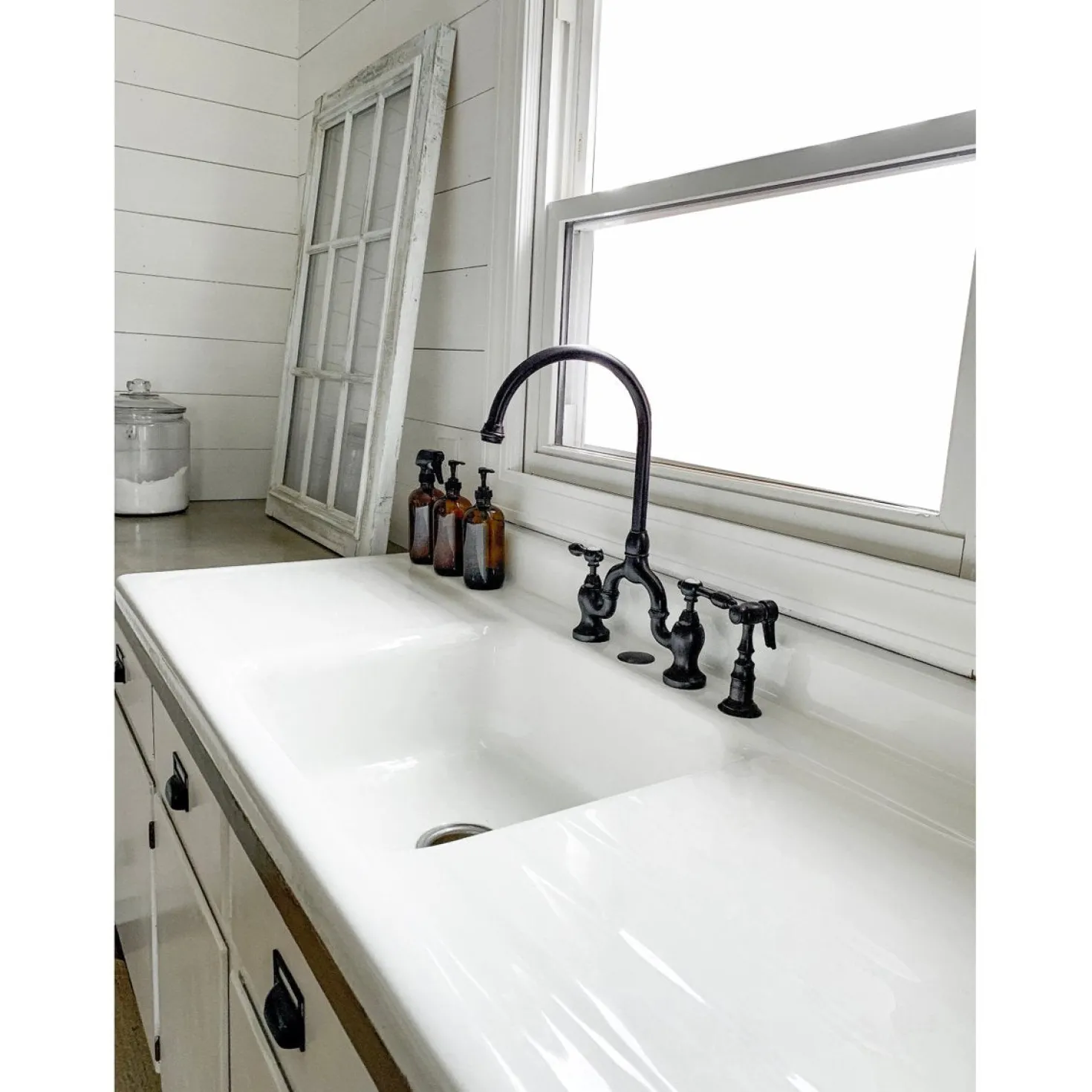 Kingston Brass Tudor Bridge Deck Mount Kitchen Faucet with Brass Sprayer