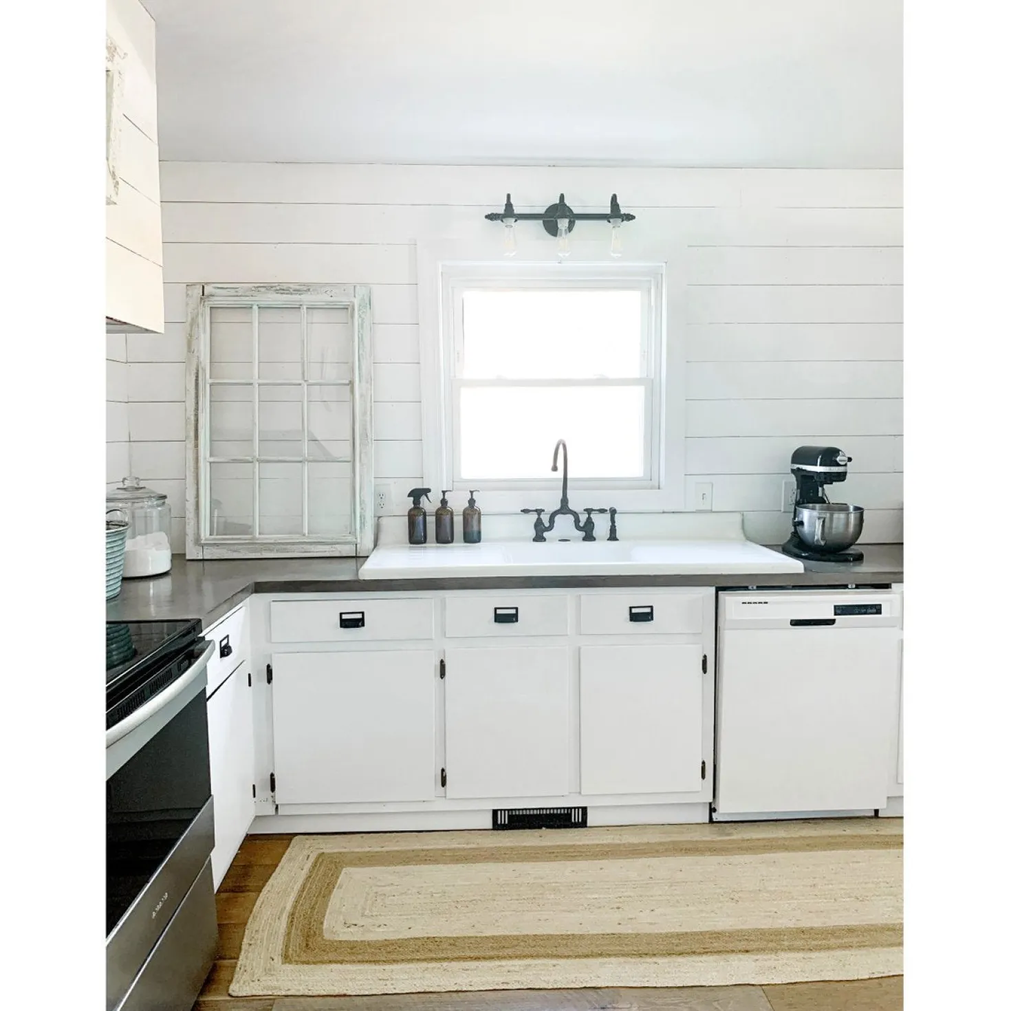 Kingston Brass Tudor Bridge Deck Mount Kitchen Faucet with Brass Sprayer