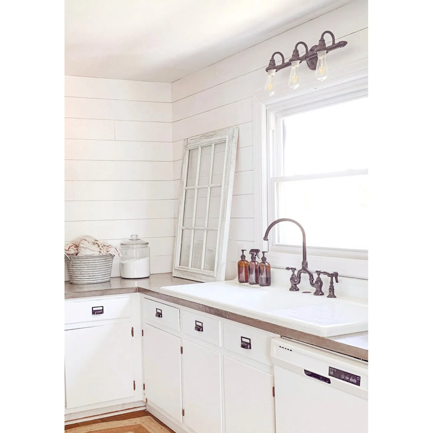 Kingston Brass Tudor Bridge Deck Mount Kitchen Faucet with Brass Sprayer