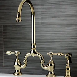 Kingston Brass Tudor Bridge Deck Mount Kitchen Faucet with Brass Sprayer