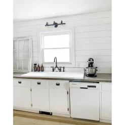 Kingston Brass Tudor Bridge Deck Mount Kitchen Faucet with Brass Sprayer
