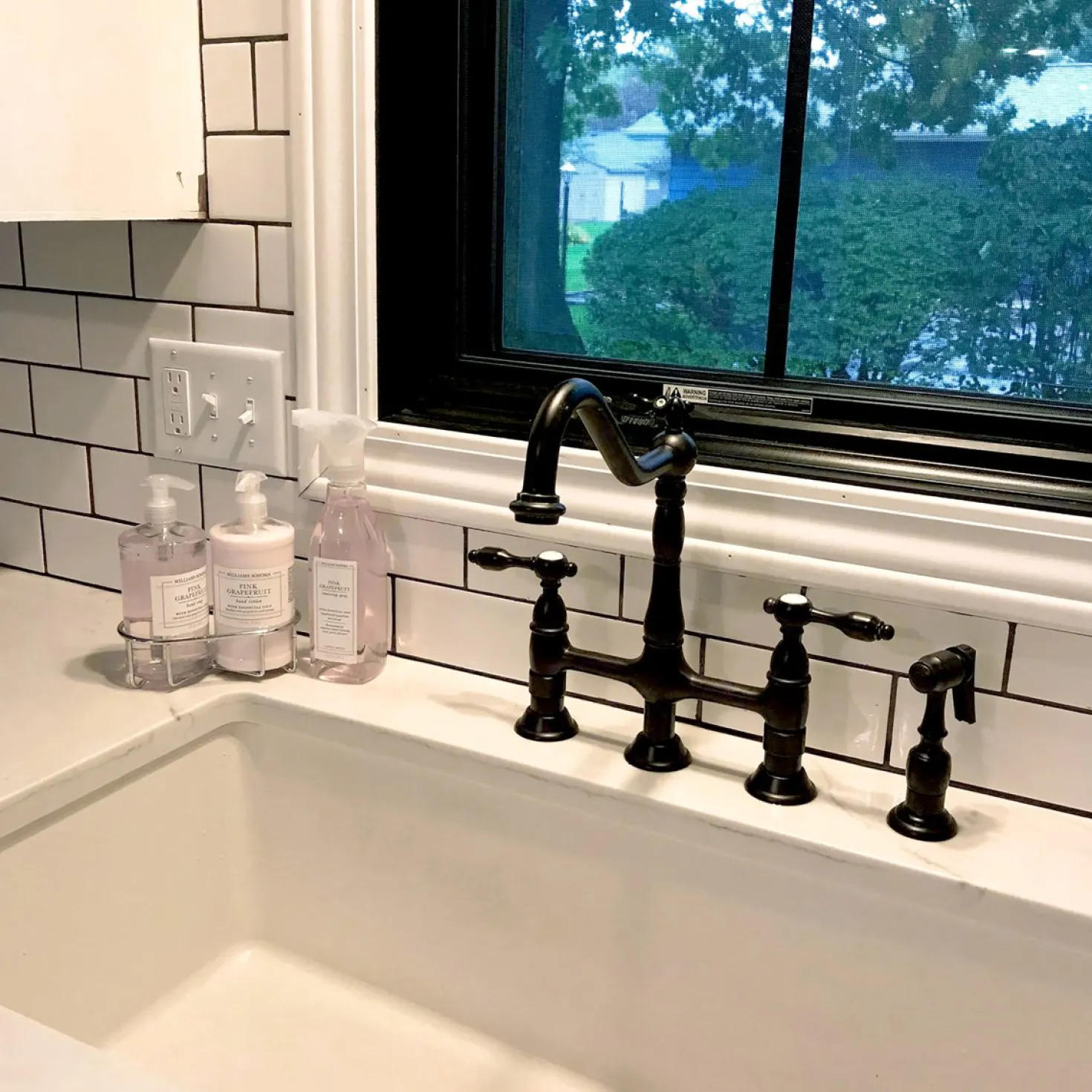 Kingston Brass Tudor Bridge Kitchen Faucet with Brass Sprayer