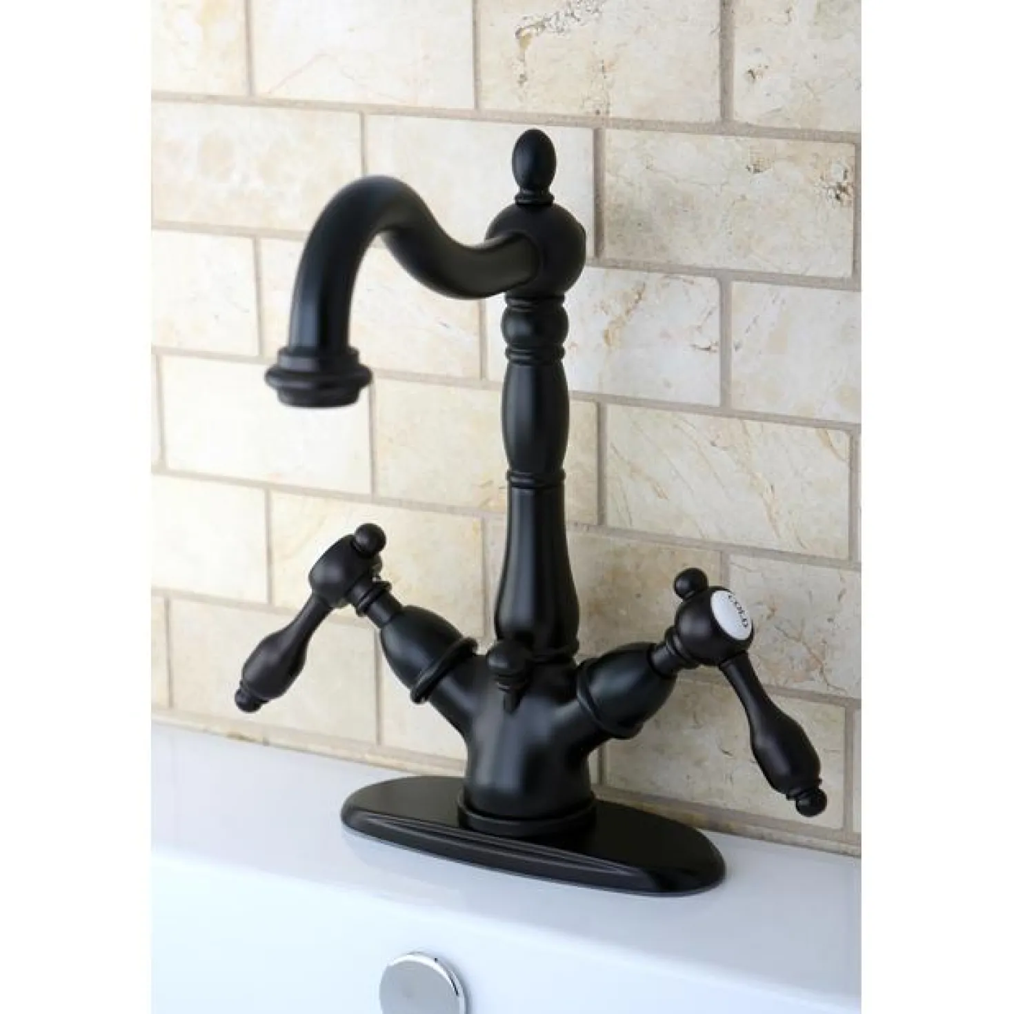 Kingston Brass Tudor 4" Center Lavatory Faucet with Brass Pop-up