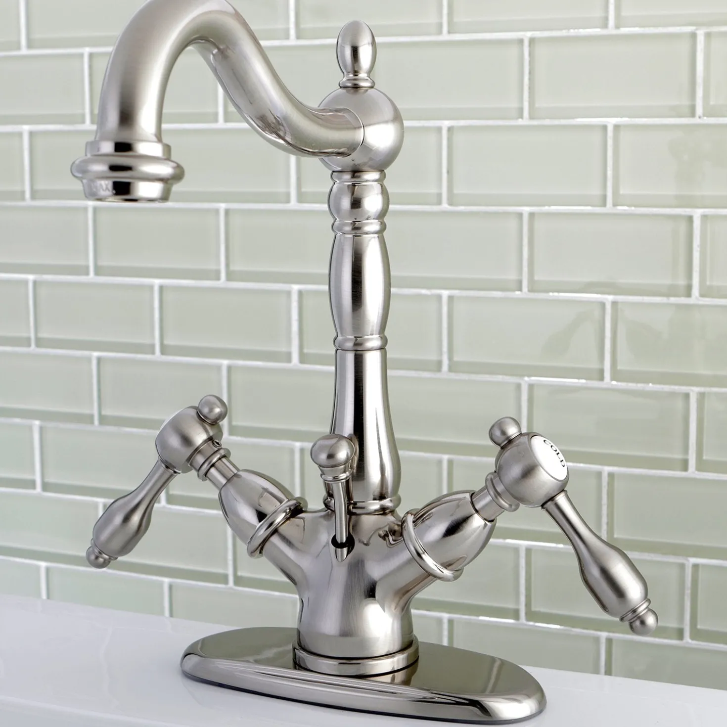 Kingston Brass Tudor 4" Center Lavatory Faucet with Brass Pop-up