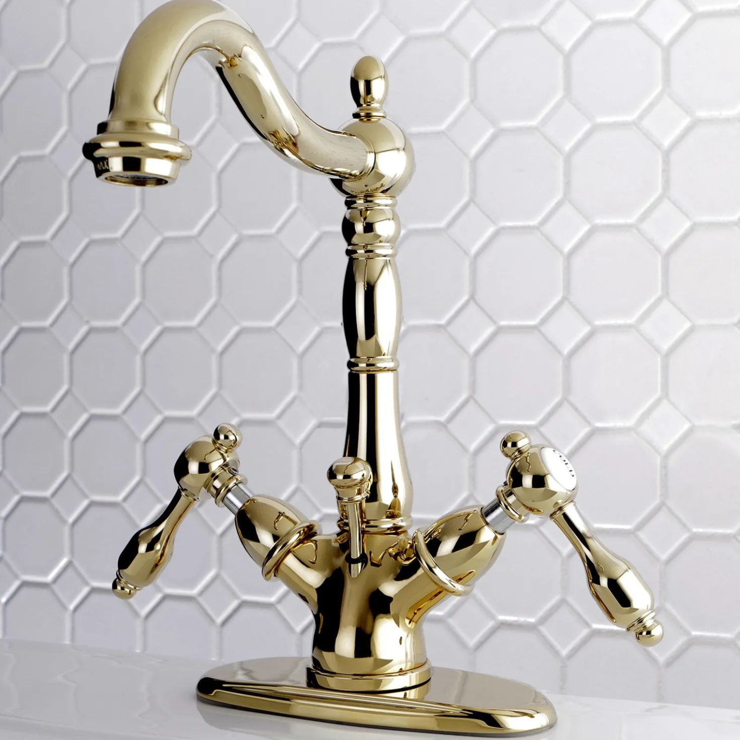 Kingston Brass Tudor 4" Center Lavatory Faucet with Brass Pop-up in Polished Brass
