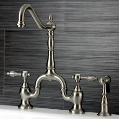 Kingston Brass Tudor Deck Mount Bridge Kitchen Faucet with Brass Sprayer