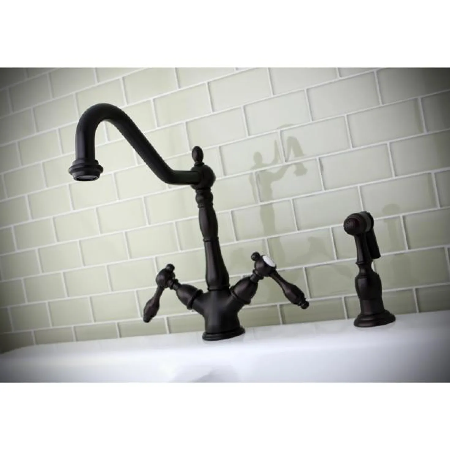 Kingston Brass Tudor Mono Deck Mount Kitchen Faucet with Brass Sprayer