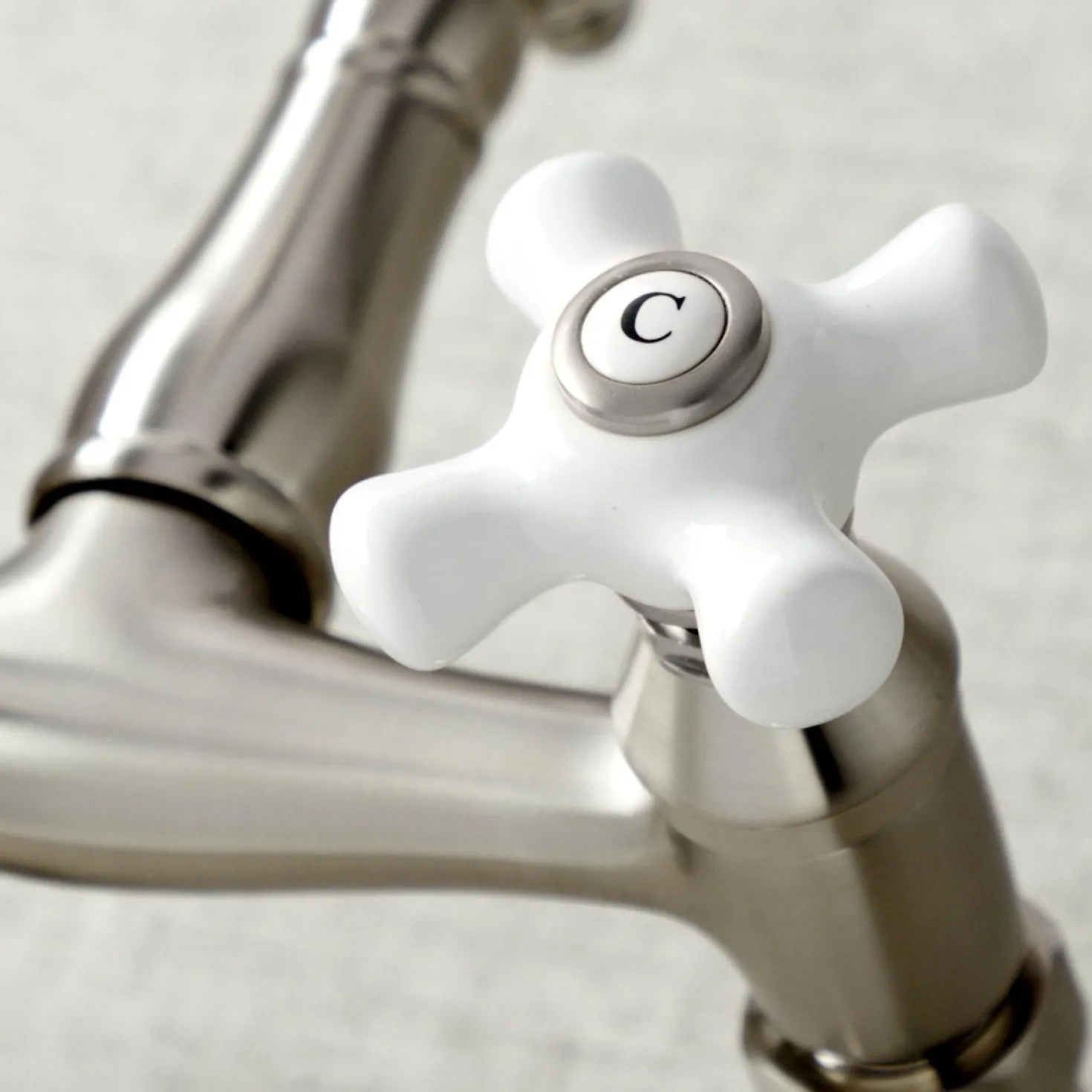 Kingston Brass Vintage Wall Mount 6-Inch Adjustable Center Kitchen Faucet