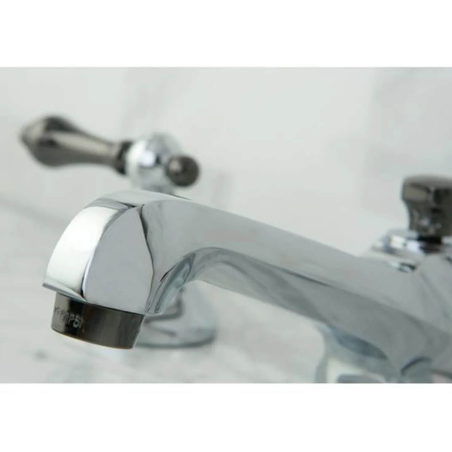 Kingston Brass Water Onyx 8" to 16" Widespread Three Hole Lavatory Faucet with Brass Pop-up Drain