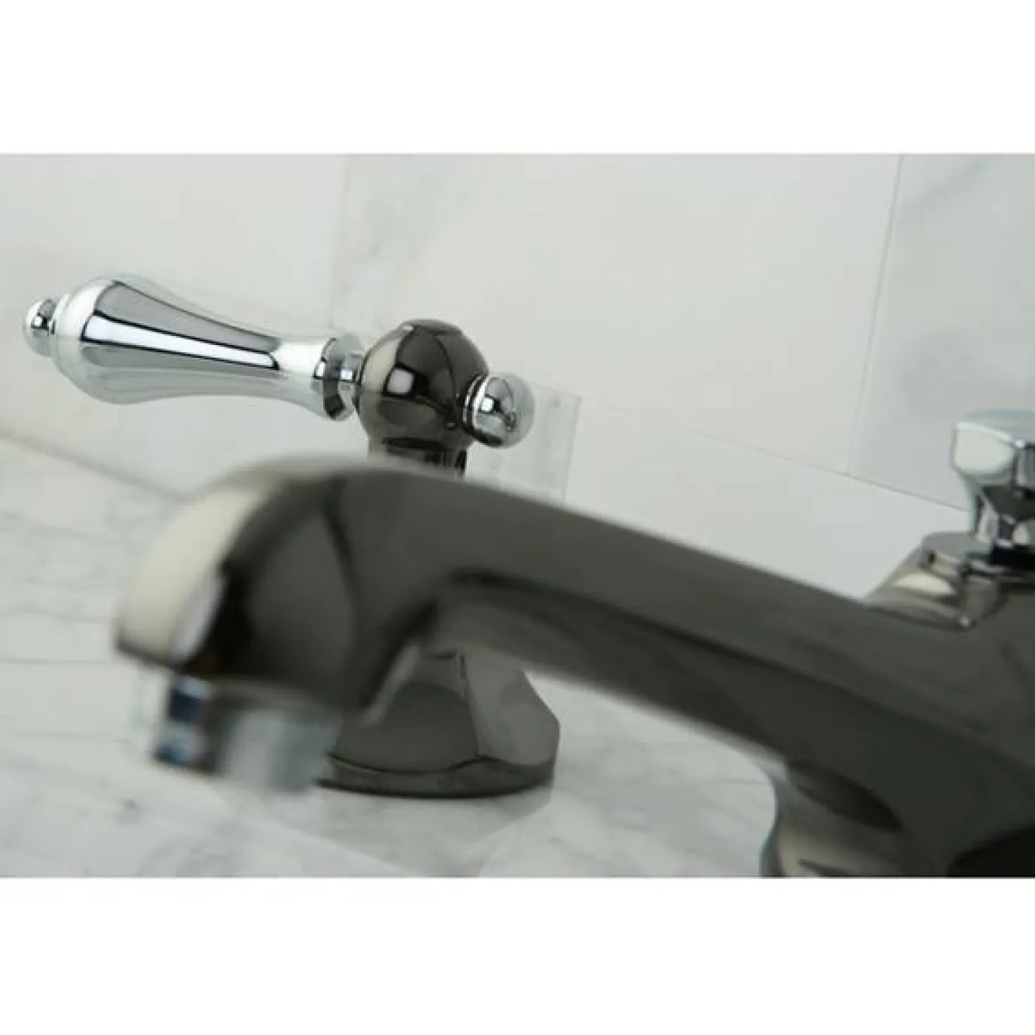Kingston Brass Water Onyx 8" to 16" Widespread Three Hole Lavatory Faucet with Brass Pop-up Drain