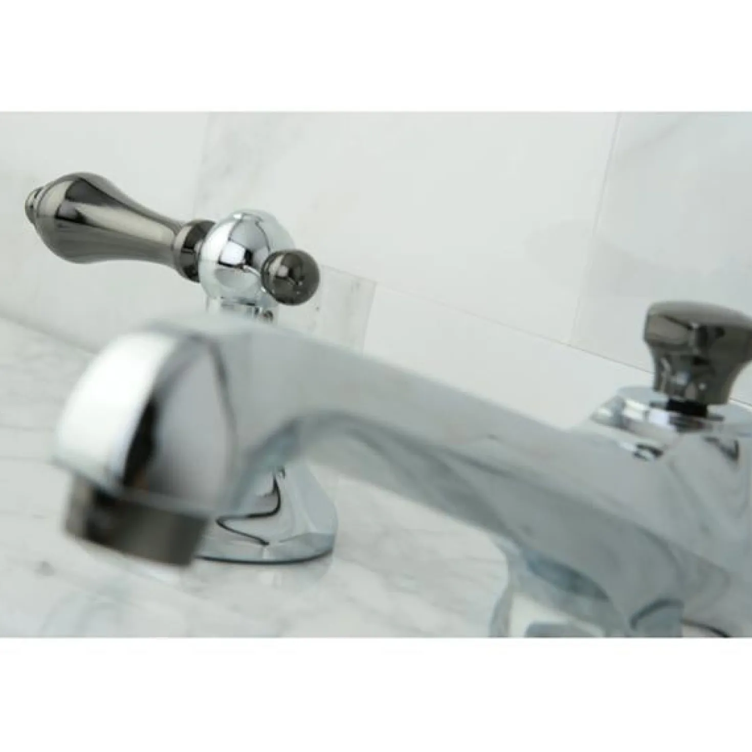 Kingston Brass Water Onyx 8" to 16" Widespread Three Hole Lavatory Faucet with Brass Pop-up Drain