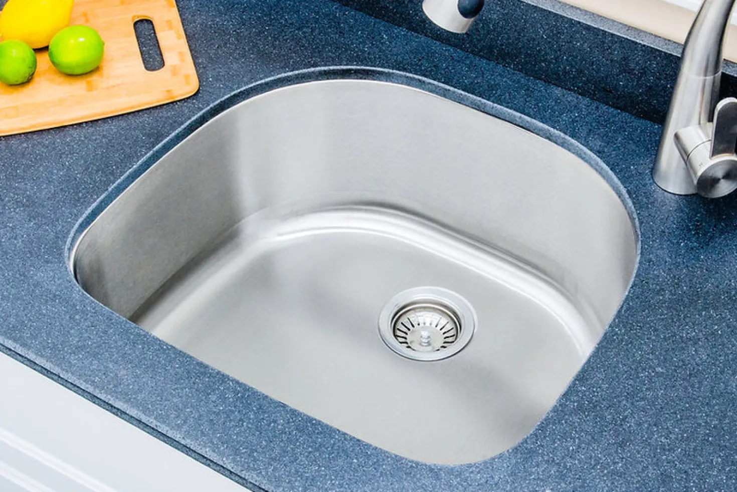 Wells Sinkware 24" 16-Gauge Undermount D-shaped Single Bowl Stainless Steel Kitchen Sink with Grid Rack and Basket Strainer